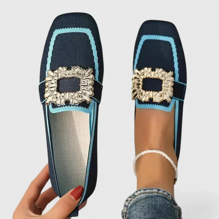 Comfort support loafer in dark blue with light blue trim and gold jeweled strap detail