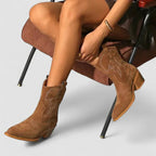 Brown western ankle boots on small block heels with stitched shaft and pull tabs