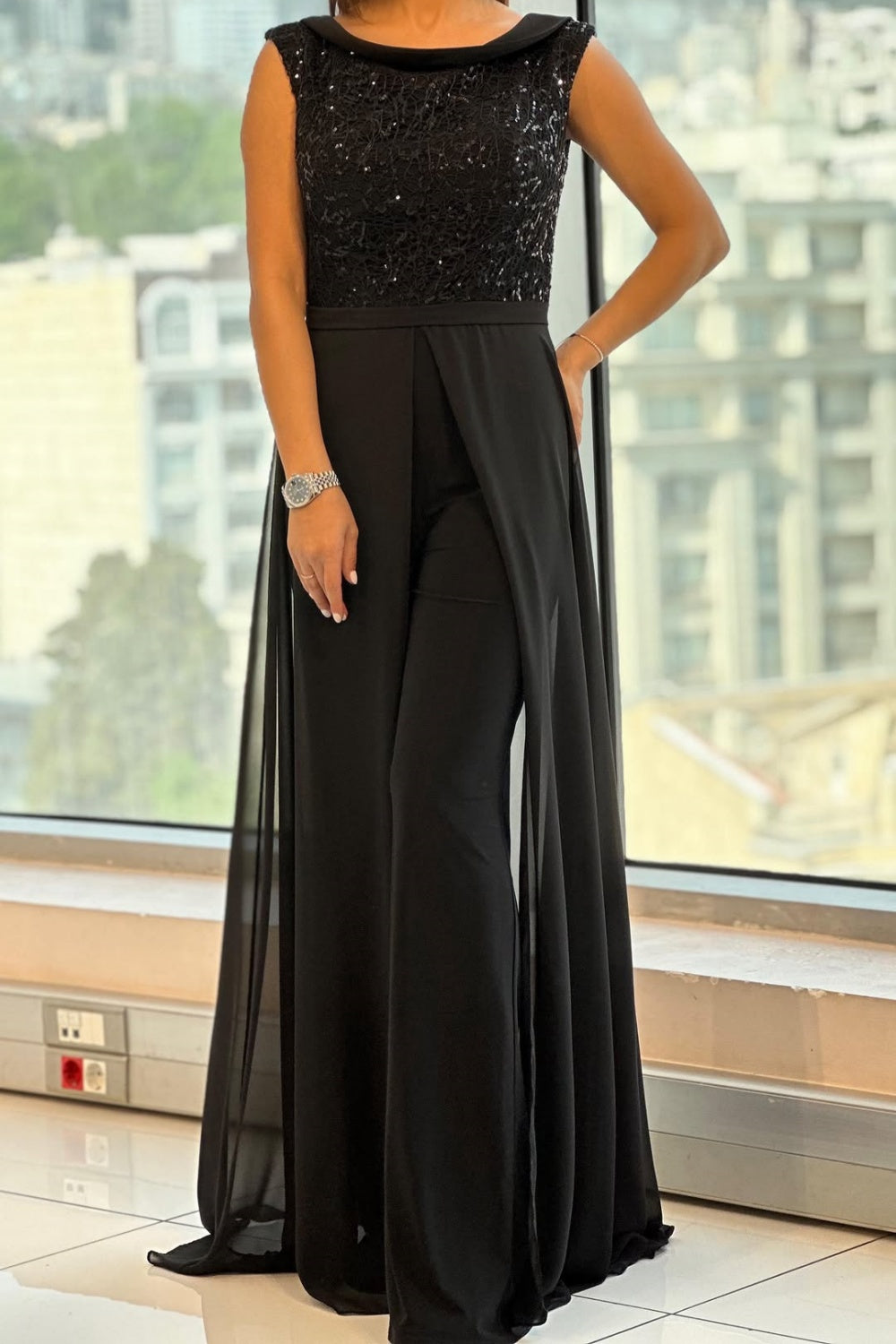 Black textured tulle sleeveless maxi jumpsuit with wide-leg drape and scoop neck