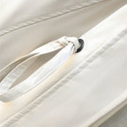 Off-white windbreaker drawcord detail with black grommet and stitched channel