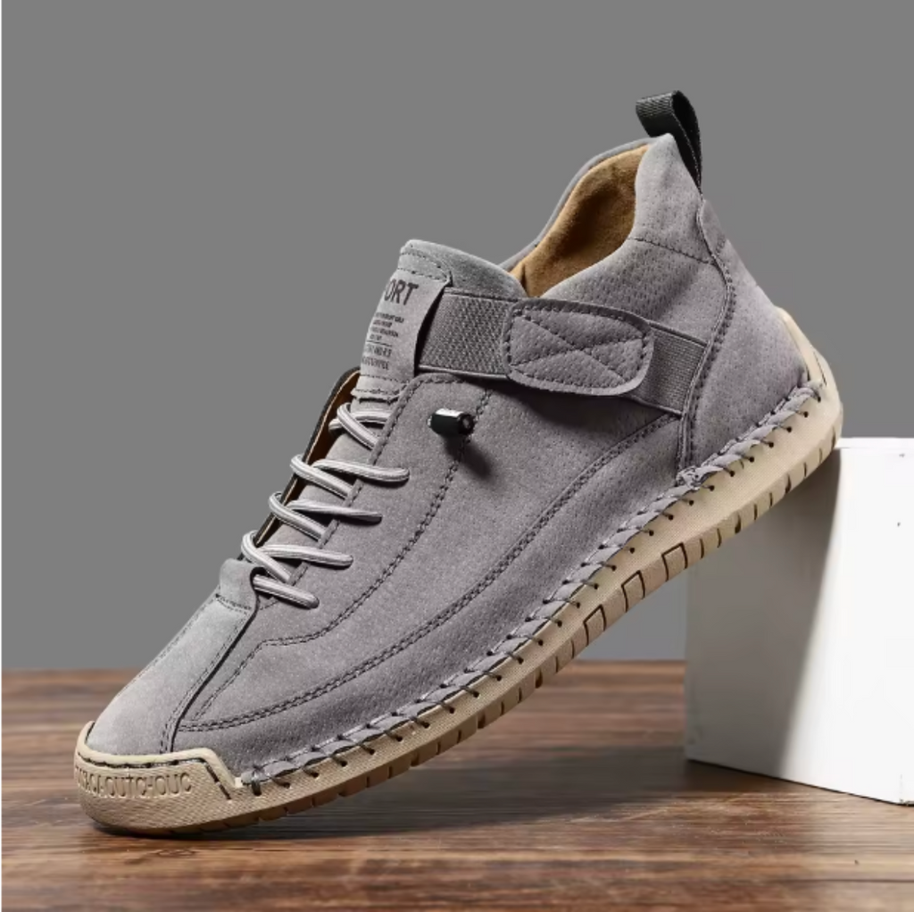 Gray comfort support sneaker with lace-up, ankle chain, and padded side strap