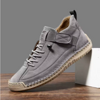 Gray comfort support sneaker with lace-up, ankle chain, and padded side strap