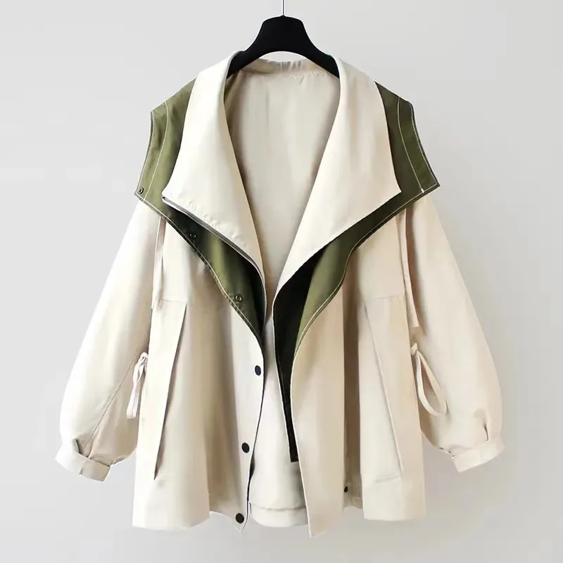 Two-tone windbreaker jacket, off-white body with dark green-lined stand collar and snaps