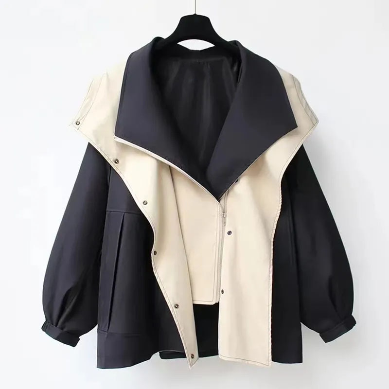 Two-tone windbreaker jacket, dark navy outer with off-white front panel and stand collar
