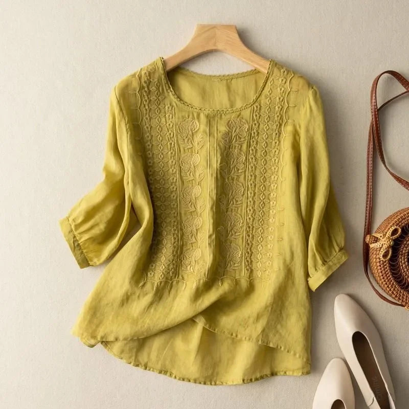 Yellow embroidered blouse with round neck, three-quarter sleeves, textured front detail
