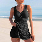 Black ruched tankini swim dress with V-neck tie and patterned draped skirt