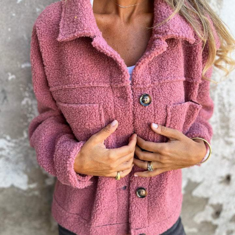 Pink teddy jacket with flap chest pockets and dark button front