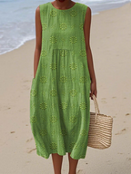 Green embroidered midi dress with sleeveless tiered design and round neckline.