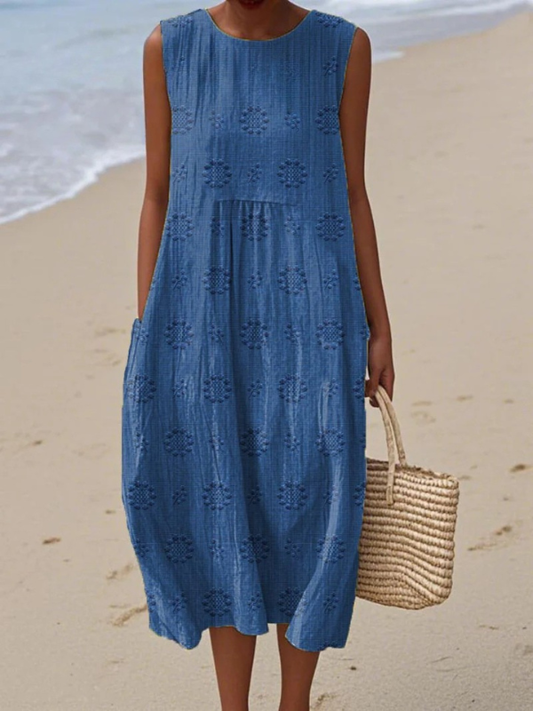 Blue patterned sleeveless midi dress with round neck and tiered skirt detail