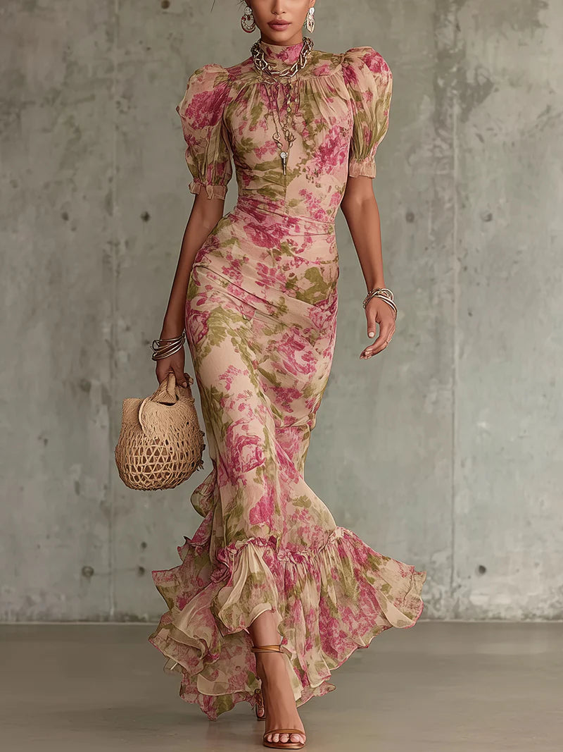 Pink rose-print maxi dress with puff sleeves, high neckline, and ruffled hem