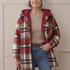 Plaid hooded flannel shacket on model, burgundy-black plaid with cream hood lining