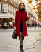 Red long coat with notched lapels and button closure, worn over a dark dress
