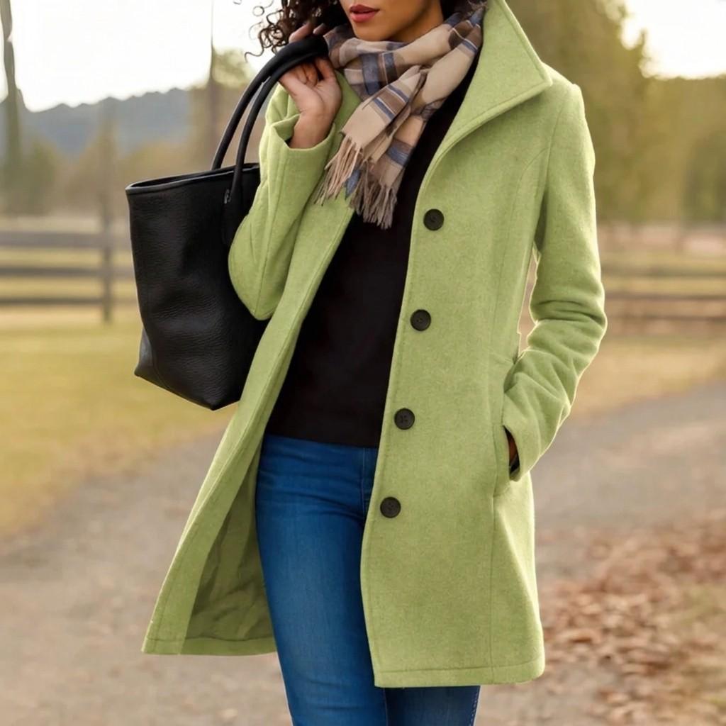 Light green long button-front coat with notched lapels and flap pockets, lined.