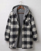 Hooded flannel shacket in black-and-white plaid with sherpa-style hood lining