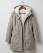 Khaki waterproof long parka with sherpa-lined hood, full zip, and front flap pockets