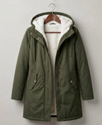 Forest green waterproof long parka with sherpa-lined hood, full zip, and side pockets