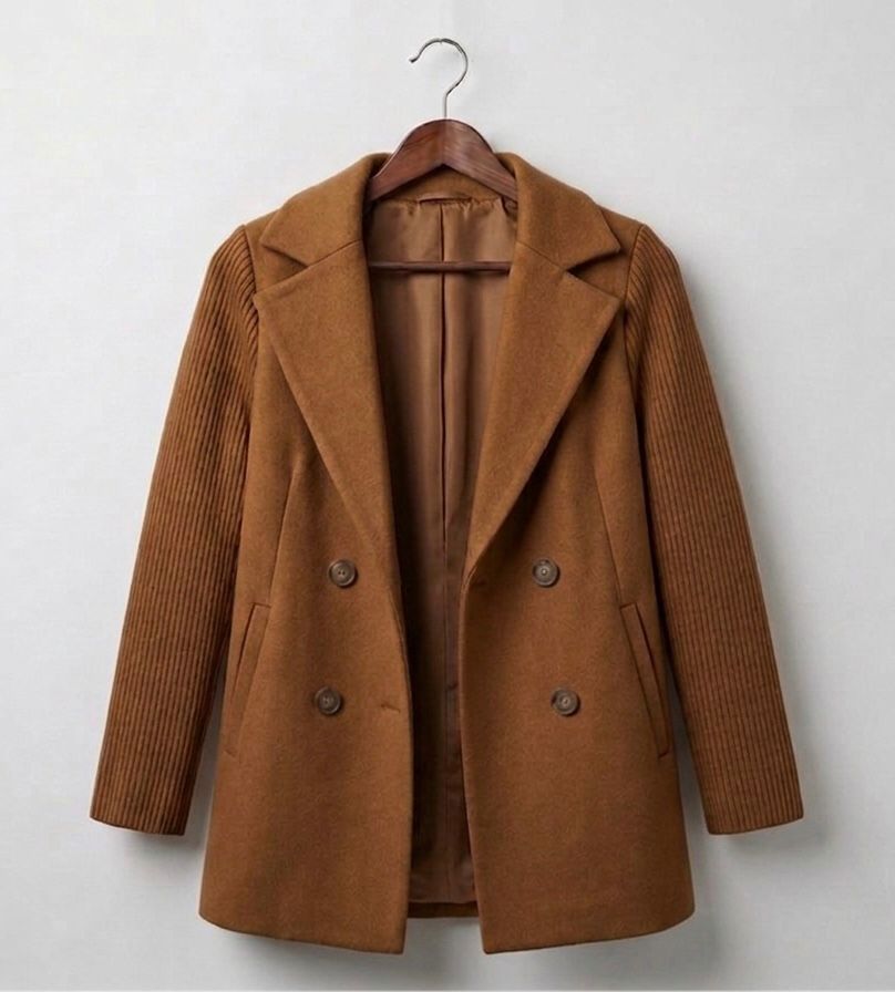 Ribbed blazer coat in rust brown, close-up of lapels, four buttons, and ribbed sleeves