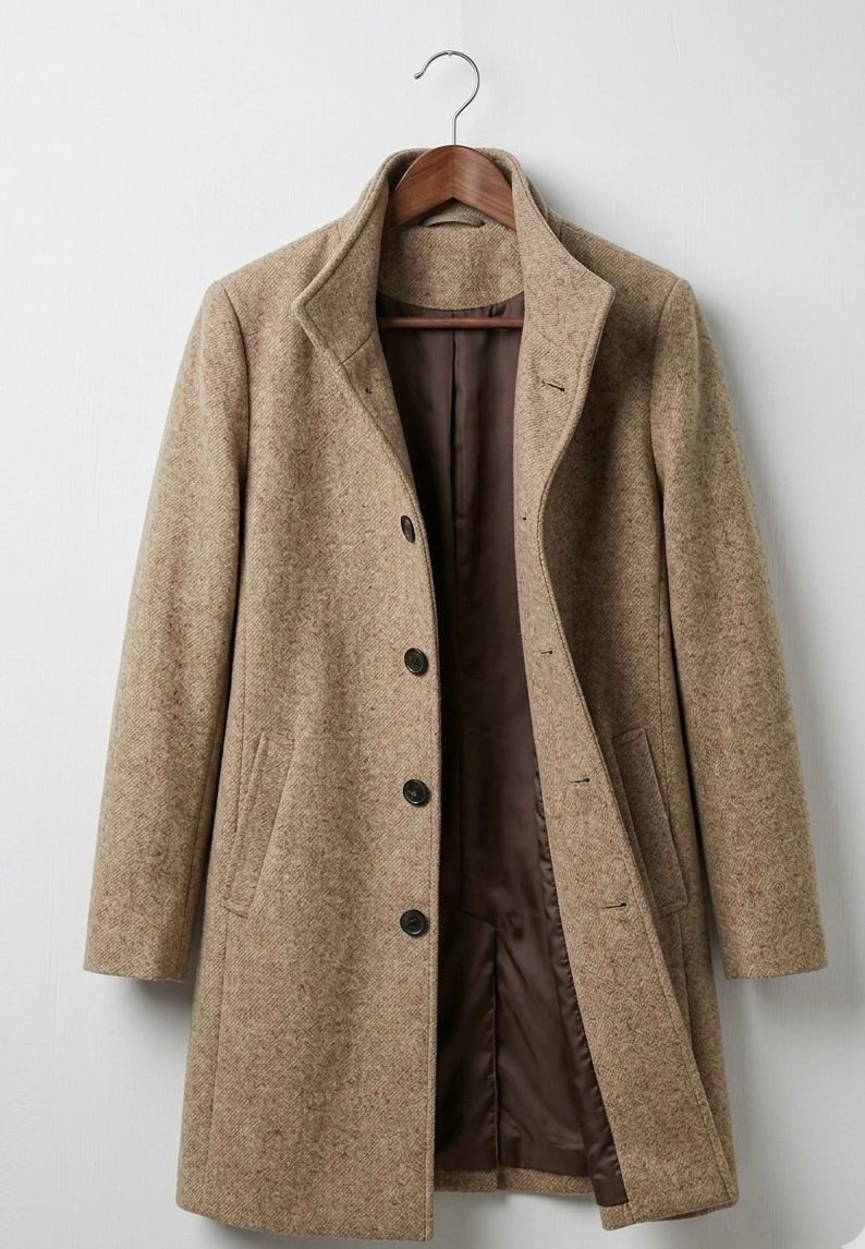 Beige long coat with notch lapels, dark buttons, and two front pockets.