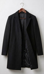 Black long coat with notch lapels, dark buttons, and quilted inner lining.