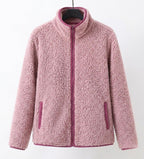 Pink teddy jacket with full-zip front and stand collar, long sleeves.