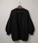Black relaxed knit cardigan with open front and ribbed cuffs