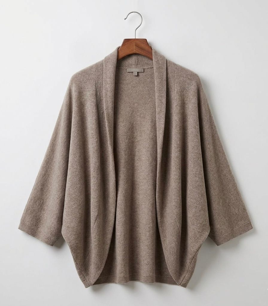 Taupe merino wool shawl hanging on a hanger, open front