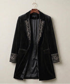 Black velvet blazer with embroidered trim on lapels and cuffs, flap pockets