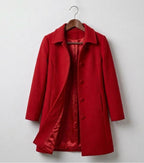 Red double-breasted coat with notched lapels and button front, long sleeves, lined hem