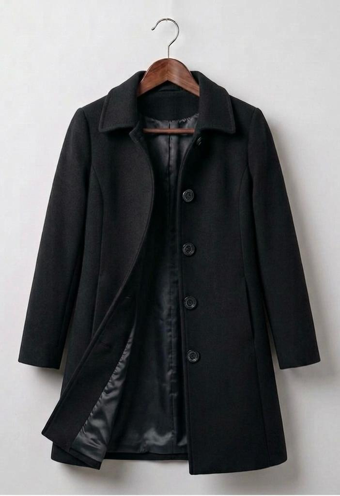 Black double-breasted coat with notched lapels, button front, and visible inner lining panel