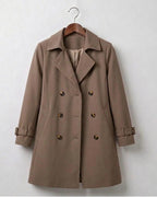 Khaki double-breasted trench coat with wide lapels and belted waist