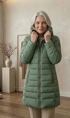 Olivia™ quilted A-line winter coat in light green with hood, zip front, zip pockets.