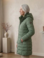 Olivia™ quilted A-line winter coat in dark green with hood and zip front detail.