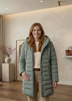 Olivia™ quilted A-line winter coat in light green with hood, zip front, side zips.