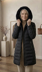 Olivia™ quilted A-line winter coat in black with hood lining and zip front pockets.