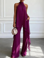 Purple halter two-piece set with draped asymmetrical top and wide-leg trousers