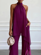 Purple halter two-piece set with high neck draped top and wide-leg trousers