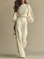 Ivory ribbed crewneck top and high-waisted wide-leg pants suit, full length view