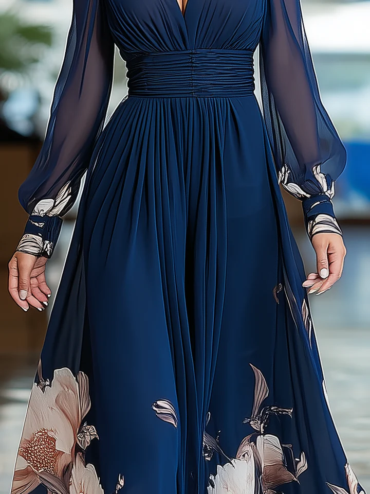 Navy blue pleated maxi dress with ruched waist and floral print at skirt