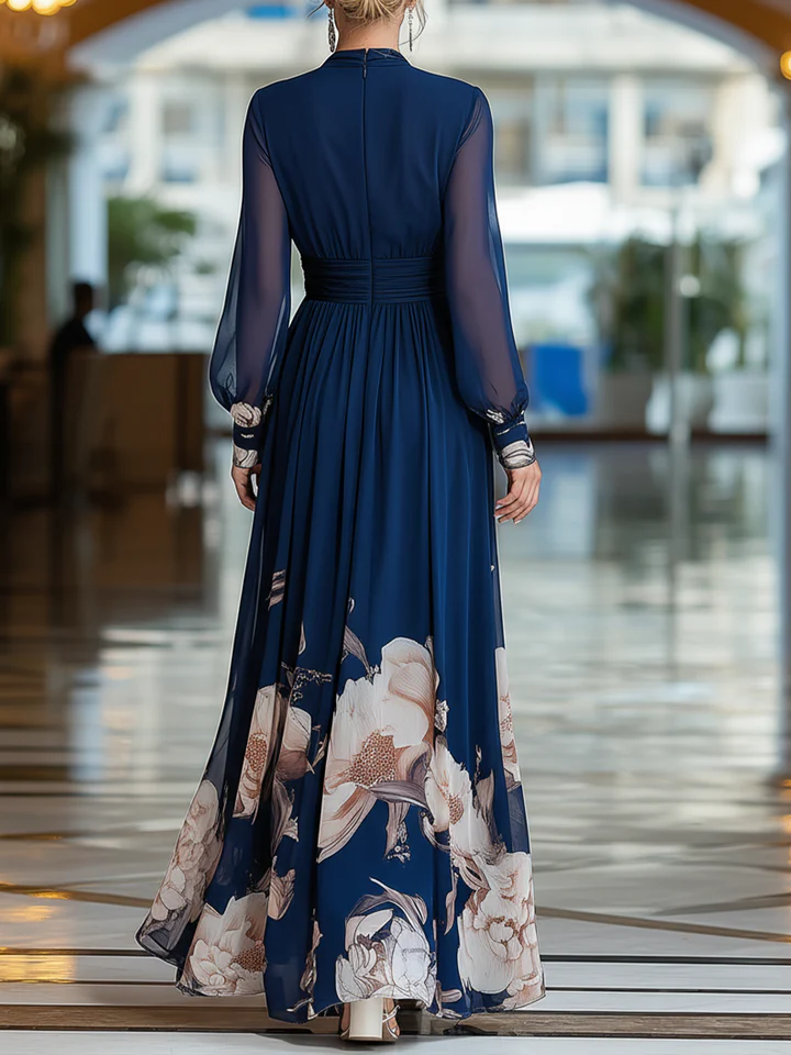 Back view navy blue pleated maxi dress with floral hem and sheer long sleeves