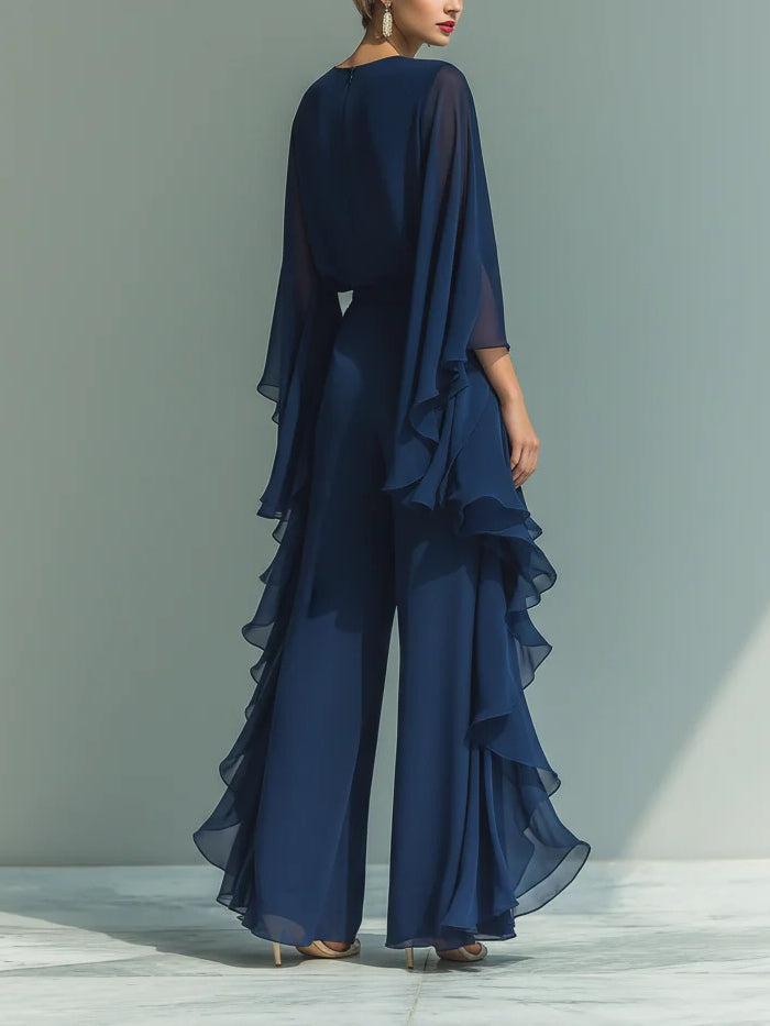 Navy elegant set, side view: layered ruffle skirt with chiffon cape sleeves