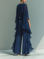 Navy elegant set, side view: layered ruffle skirt with chiffon cape sleeves