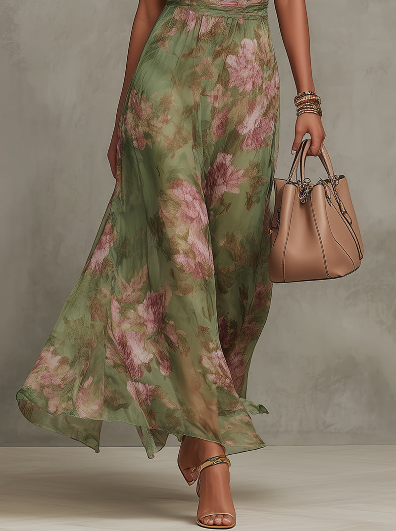 Floral chiffon halter maxi dress in green with pink blooms, flowing tiered-look skirt