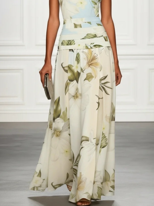 Floral sleeveless maxi dress front view, cream with green leaf print and tiered skirt