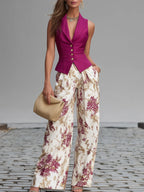 Rose pink sleeveless vest and floral wide-leg pants set, front view with button detail