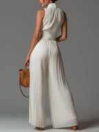 White pleated sleeveless wide-leg jumpsuit with high back and zip front