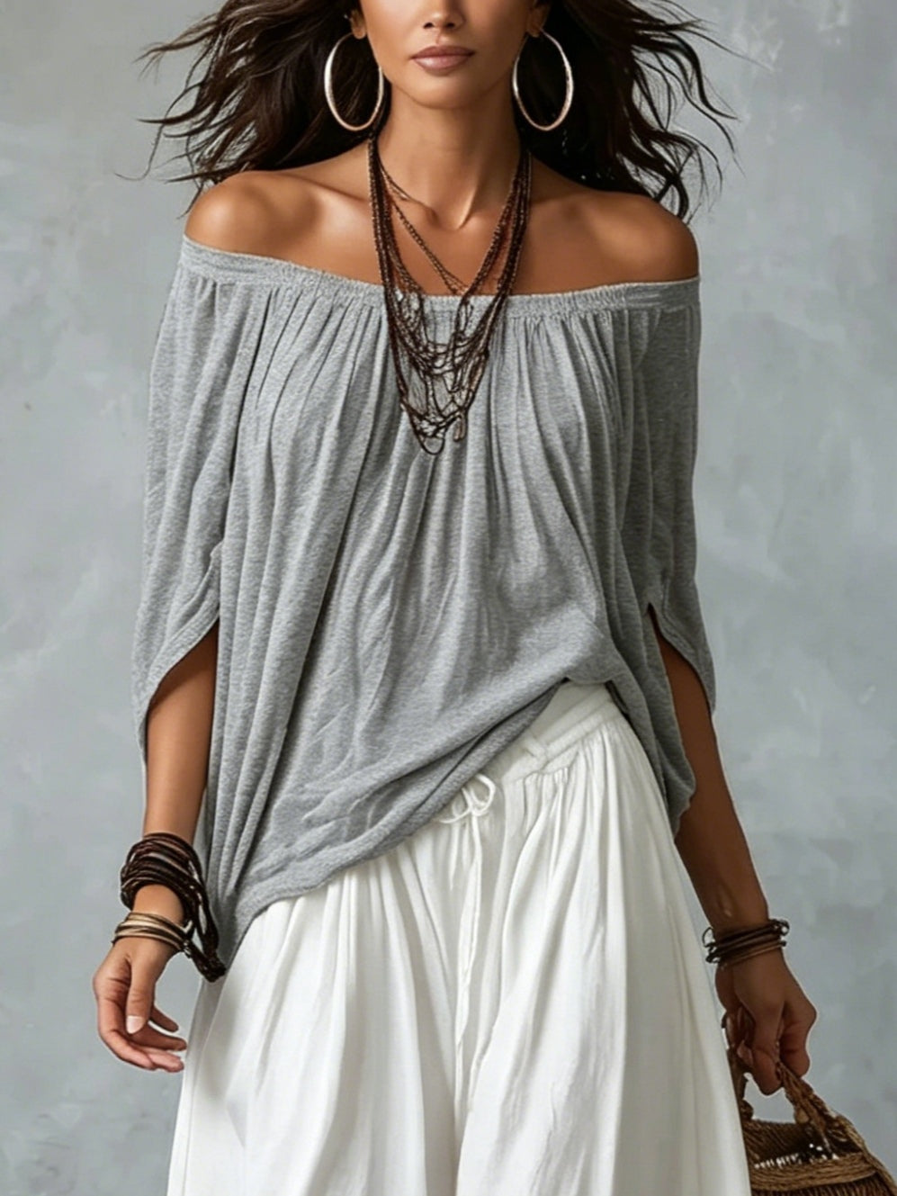 Grey off-shoulder draped top over white gathered lantern pants