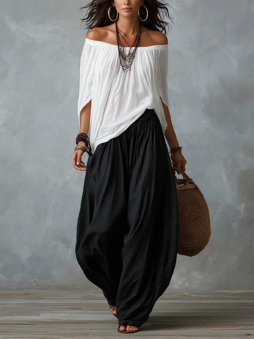 White off-shoulder peasant top with black loose lantern pants set