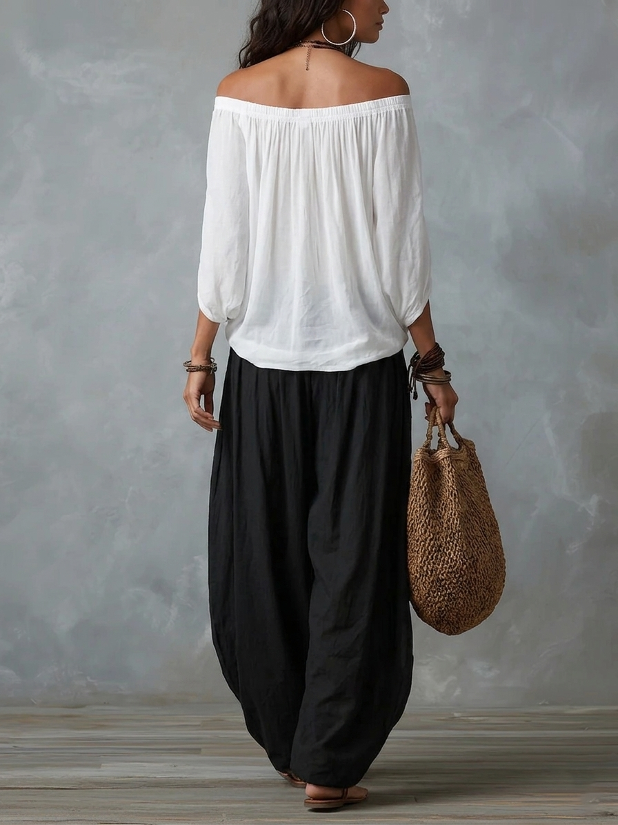 Off-shoulder white blouse with black lantern pants, back view