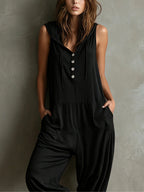 Black hooded sleeveless jumpsuit with five-button front and side pockets