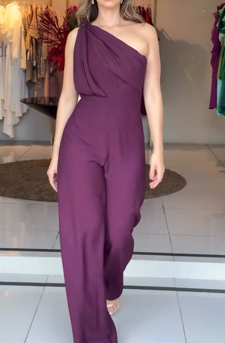 Purple one-shoulder jumpsuit with draped diagonal neckline and wide-leg pants